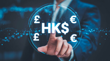 Businessman touching HKD currency symbol on a digital globe with bokeh lights Hong Kong Dollar
