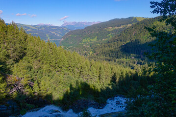 Alpine Stream Flowing Through the Alps on a Summer Morning 