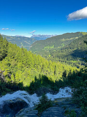 Mountain Stream flowing through the Alps in the Summertime 
