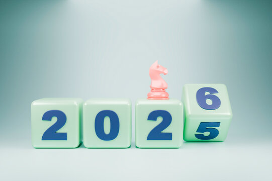 The wooden blocks display the year 2025-2026, with a small chess piece 