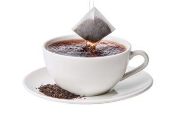 Tea bag dripping into a cup of hot tea