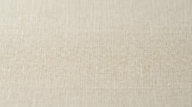 Close Up View of Light Cream-Colored Burlap Fabric Background Texture
