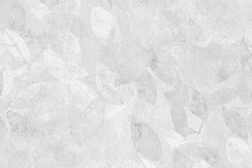 Naklejka premium grey plaster wall with subtle Leaf and floral art creating a minimal abstract background.