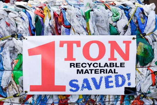 Santa Fe, New Mexico, United States. Collection point for recycled goods. Bundle of recycled plastic with sign saying 1 Ton of Recycled Material Saved 
