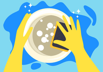 Hands in a yellow rubber gloves with cleaning sponge washing a dish on a blue background with a copy space
