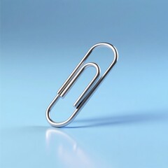 Silver Metal Paperclip Standing Upright on Blue Background Office Stationery
