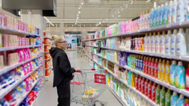 Choosing washing powder ,detergent,liquids at Groceries.