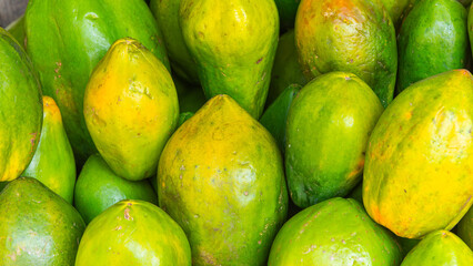 Ripe and Juicy Yellow Pawpaws at a Kenyan Market Stall

Ripe, juicy yellow pawpaws displayed at a busy Kenyan market stall, highlighting fresh tropical fruit and vibrant local produce