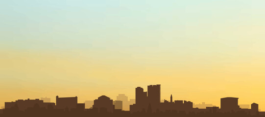 Panoramic poster of the city skyline with misty background buildings, hills sunrise, sunset and clouds of MALAGA, SPAIN