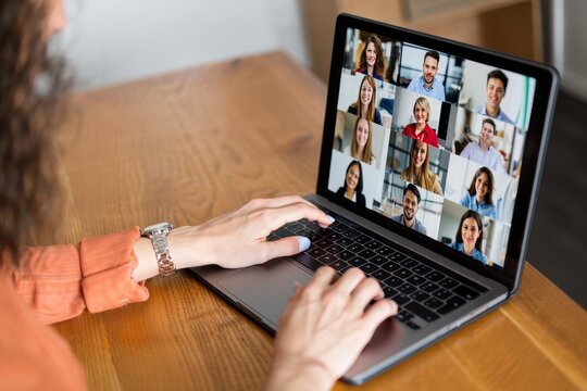 Woman Participating in a Diverse Video Conference Call on Laptop