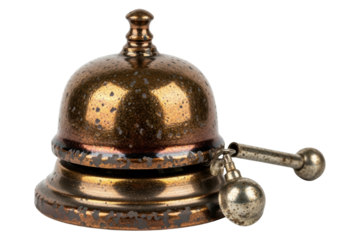 Vintage bronze hotel service bell with a worn speckled finish isolated on transparent background