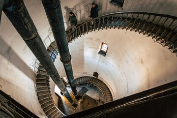 Obraz premium Inside the Historic Water Tower with Riveted Steel Tank, Spiral Staircase, Preserved Industrial Heritage in Komarno, Komarom, Slovakia