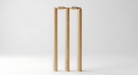 Wooden cricket wicket with sturdy stumps and bails on white background.