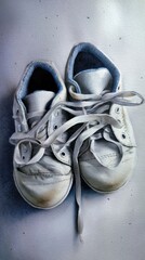 Artistic watercolor painting of tiny sneakers on a clean surface