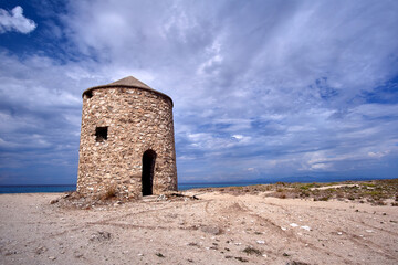 The stone ruin of a traditional Greek windmill on the island of Lefkada