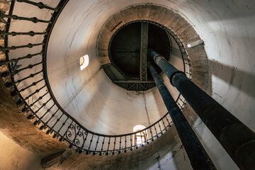 Obraz premium Inside the Historic Water Tower with Riveted Steel Tank, Spiral Staircase, Preserved Industrial Heritage in Komarno, Komarom, Slovakia