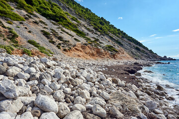 Cliff, stones, and boulders on a beach on Lefkada Island