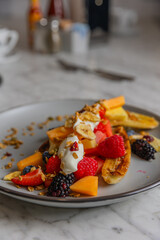 grilled bananas with fruit and yogurt on plate