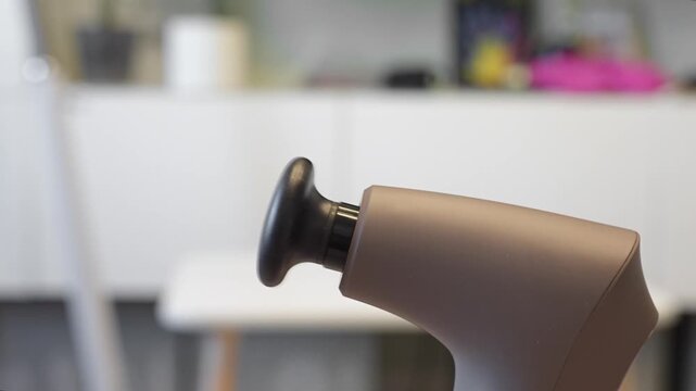 A working percussion massager in the living room