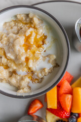 oatmeal with side of fruit in bowl