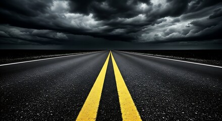 Dramatic empty highway stretching towards a dark stormy sky with ominous clouds