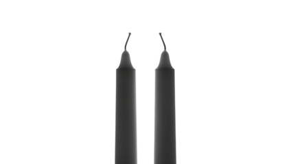 Two black taper candles isolated on transparent background, creating a simple and elegant composition with a minimalist aesthetic