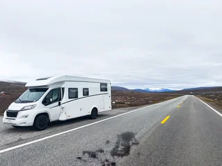 Fototapeten Polarkreis Exploring the nordic landscapes: a white camper van on a scenic road in norway, heading towards the arctic circle for an adventurous journey  © Alberto Gonzalez 
