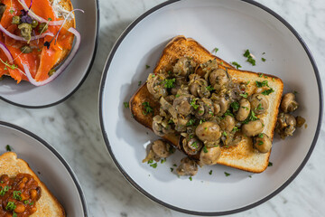 mushroom toast on plate in hard light