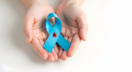 Hands gently holding a blue ribbon with a drop of blood, symbolizing diabetes awareness and support.