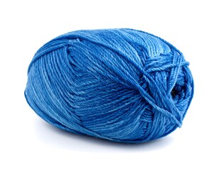 Close-up of a blue yarn ball isolated on a white background ready for crafting