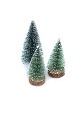 On a white background there are three small decorative Christmas trees.