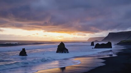 Dramatic sunset over a black sand beach with sea stacks and crashing waves Keywords: sunset, beach, black sand, sea stacks, rock - Powered by Adobe