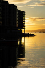 Modern Waterfront Architecture in Tjuvholmen Oslo Norway - Sunset Silhouette Reflections