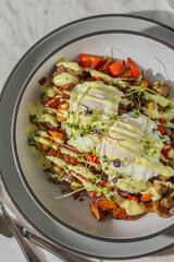 corned beef hash with eggs in hard light
