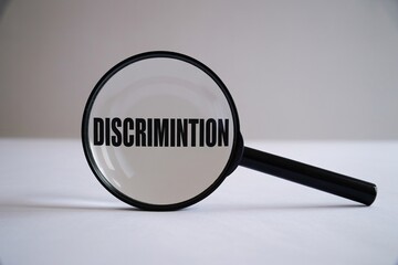 Understanding discrimination concept with magnifying glass and typo error view