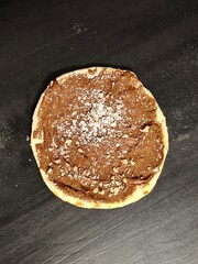 Chocolate Dessert Pizza with Crushed Hazelnuts