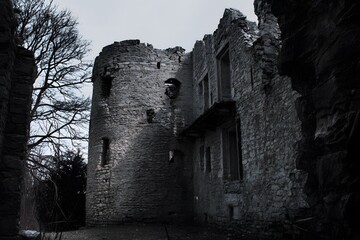 Abandoned Castle in Ruins Under a Gloomy Sky