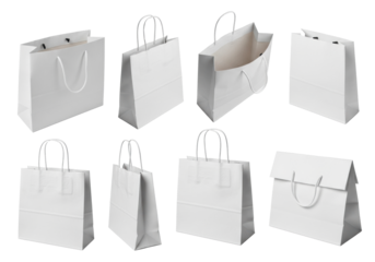 Six blank white paper shopping bags with twisted handles, natural textured, isolated on pristine transparent background with copy space, concept of sustainable packaging