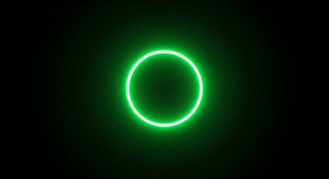A glowing green circle emits a vibrant and ethereal light against a dark backdrop, creating a captivating and modern visual effect