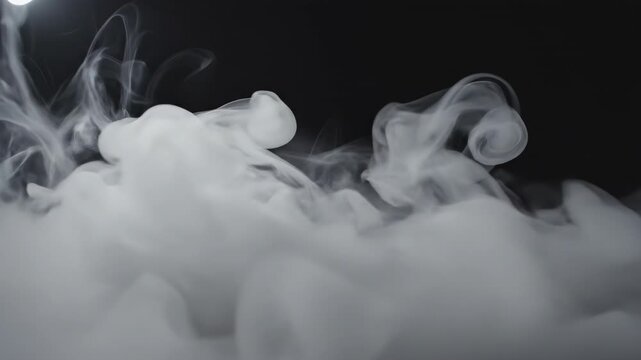 Mysterious Vapor: A captivating swirl of vapor dances against a dark canvas, its ethereal forms creating an atmosphere of intrigue and wonder.