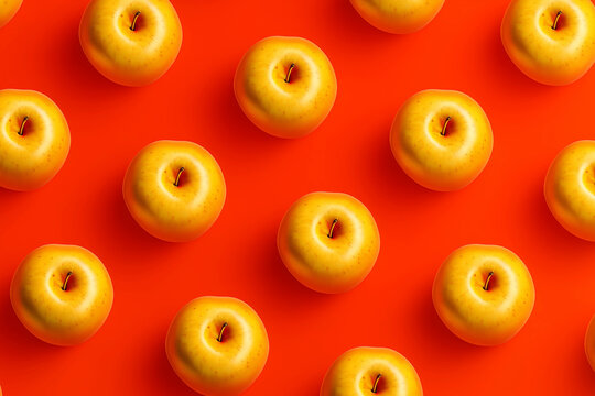 Pattern of bright yellow apples on a vibrant red background