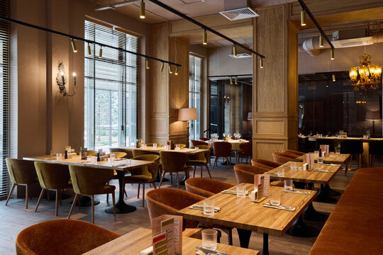 comfortable space with refined details, open restaurant space with ambient lighting and sophisticated decor