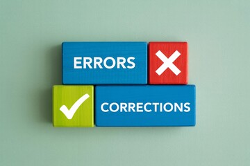 Errors and corrections concept with check mark and x mark on wooden blocks