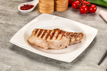 Grilled pork loin steak with bone
