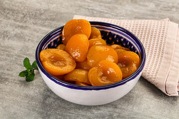 Sweet canned apricots with syrope