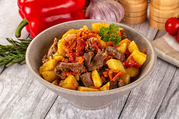 Rogiut with meat, potato and tomatoes