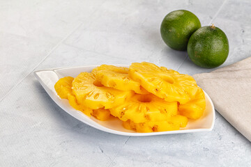 Sweet canned pineapple slices in syrope