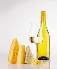 Naklejka premium Assorted cheeses and wine bottle on white background