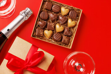 A glasses of champagne elegantly paired with a box of rich chocolates