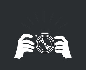 Camera in hands taking picture for photography concept